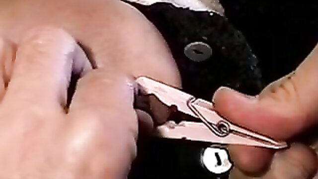 Dark-haired hot whore with nice rack teased by master using nipple clamp