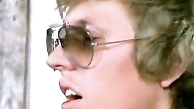 Retro Bike Gang Ball Color Climax scene 33 closeup of blonde model in aviators