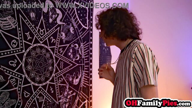 Anna Claire Clouds goth teen stepsister with curly hair holds knife by zodiac tapestry