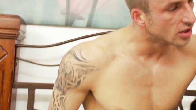 Kerry Louise seduces nude tattooed man on bed