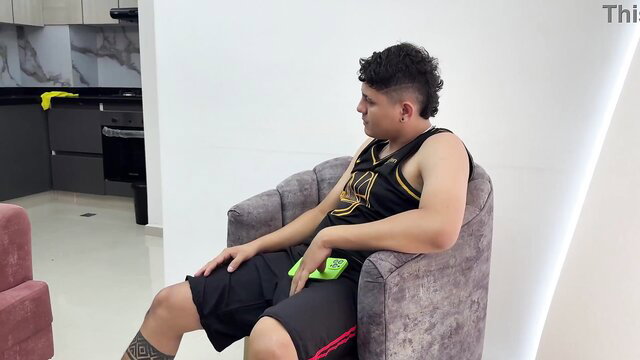 Latino guy in tank top and shorts lounging on chair in amateur stepsis tease thumbnail