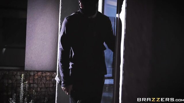 Sarah Banks as sexy brunette intruder in dark doorway Brazzers