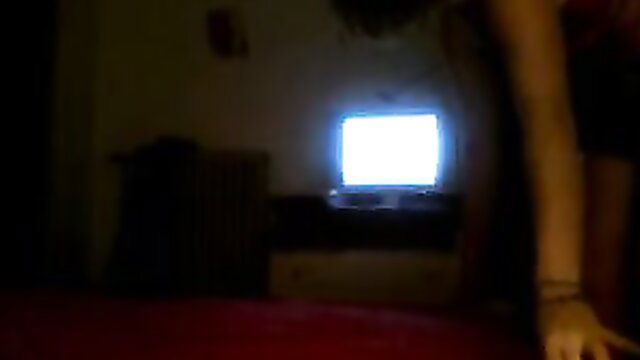 Blurry low-light amateur thumbnail of pale arm over lit screen