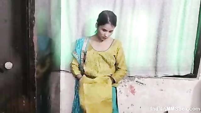 Skinny Indian Bhabhi in yellow salwar kameez leaning seductively