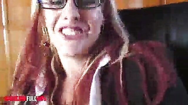 Blonde MILF in glasses smiles in hoodie before wild anal threesome