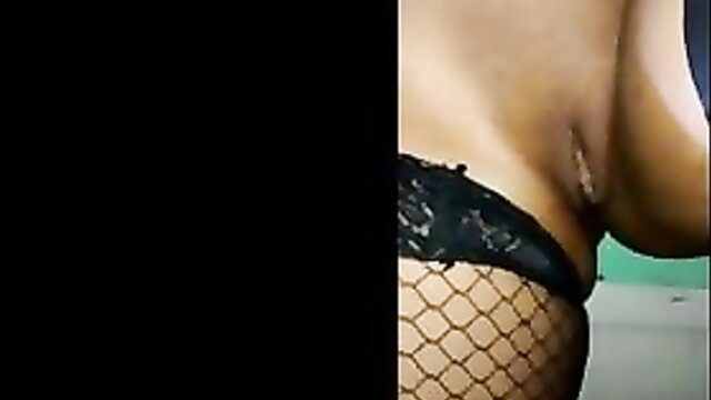 African mom in fishnet stockings and lace lingerie exposing pussy and big tits