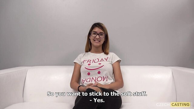 Shy babe with glasses in Friday t-shirt wants the soft stuff on white couch