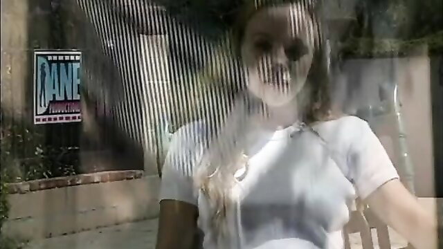 Gauge teen in sheer white top on patio, seductive pose