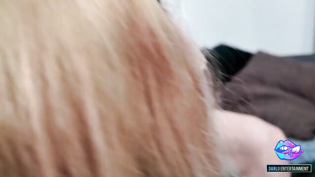 Blonde maid's closeup profile with flushed cheek in horny couple scene