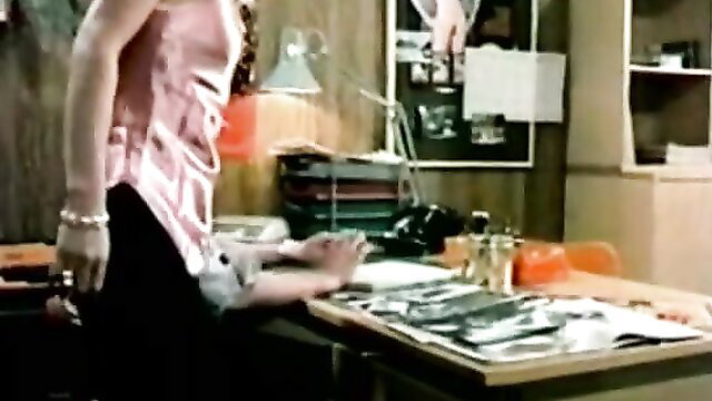 Vintage Beauty Film babe in pink top at desk intimate interview