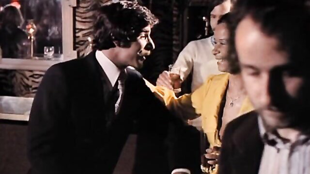 1974 Butterflies classic porn party scene with black suited man and yellow dress woman