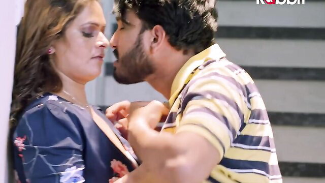 Indian couple hot kissing scene, man groping woman's big tits in blue dress