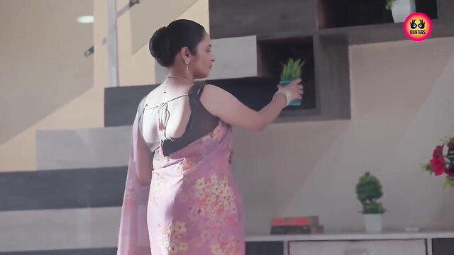 Indian MILF in sheer pink saree with deep back blouse, curvy ass view