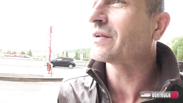 Handsome mature man in leather jacket outdoors by truck in adult video thumbnail