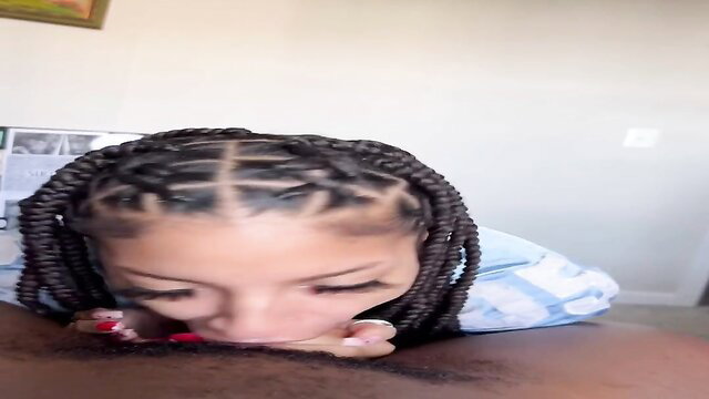 Foxy with braids gives messy close-up blowjob on black cock