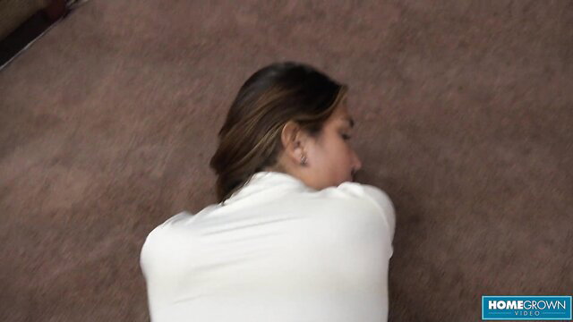 Asian naughty nurse lying face down in white top on floor