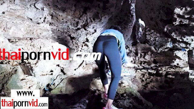 Joon Mali Thai MILF bent over in cave leggings, hot ass view