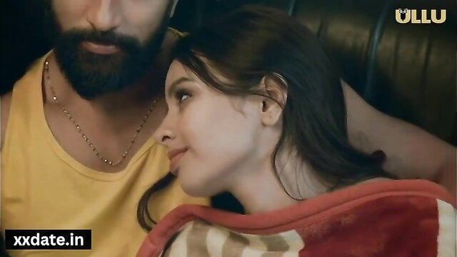 Bearded Indian man cuddles busty brunette beauty in intimate embrace