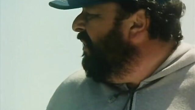 Bearded man in hoodie and cap from 1981 retro porn Nothing To Hide