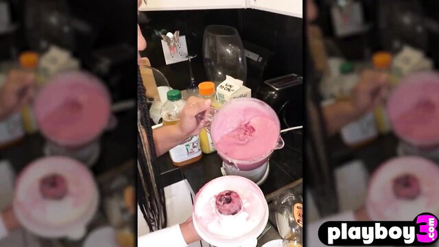 Misty Stone blending pink creamy drink in kitchen for Playboy