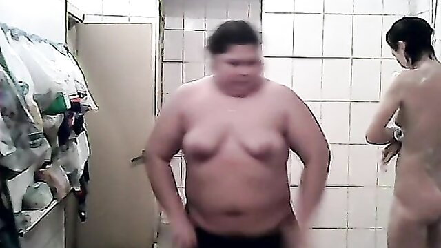 Fat Asian man and skinny nude brunette shower voyeur