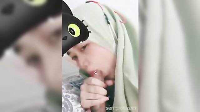 Indo hijab girl in cat ears mask gives deepthroat blowjob closeup