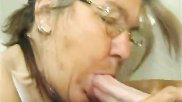 Four-eyed granny eagerly sucking thick cock in homemade blowjob