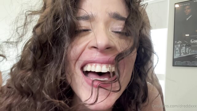 Curvy brunette laughing with open mouth in closeup adult thumbnail