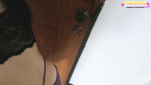 Alex Adams in black lace lingerie by door, hot delivery tease