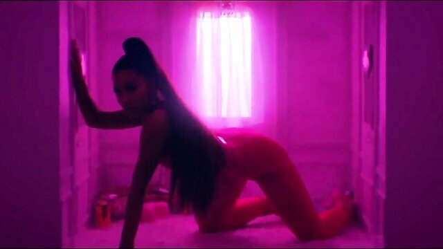Ariana Grande lookalike in tight red bodysuit, sexy pose on floor