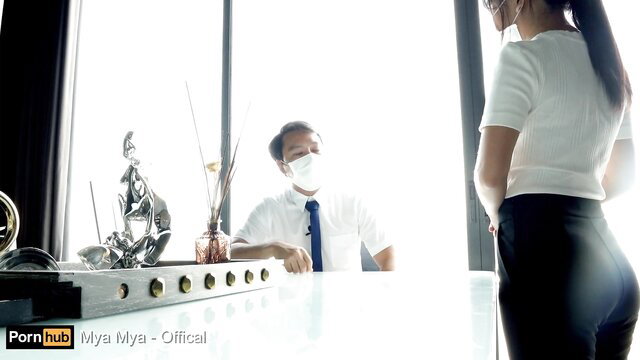 Mya Mya in tight white skirt showing huge Asian ass at hotel desk