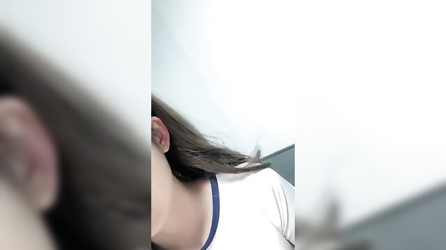Closeup of Guangzhou college girl's neck, long dark hair and white shirt