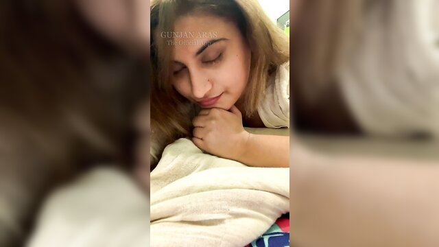 Gunjan Aras hot Indian beauty resting face down on bed