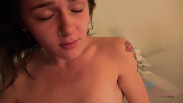 Rosalyn Sphinx topless closeup with shoulder tattoo, seductive eyes