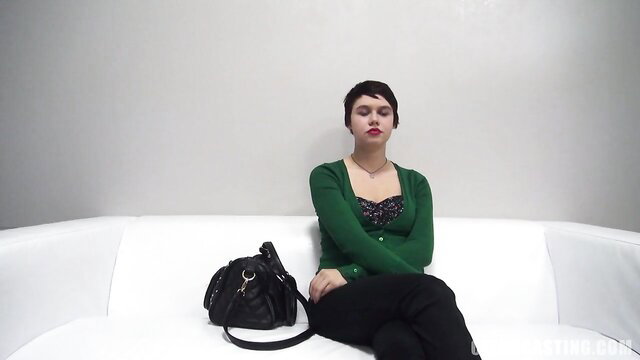 Short-haired amateur chick in green cardigan on casting couch