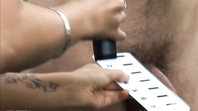 Reporter CFNM woman measuring hairy man's cock with ruler
