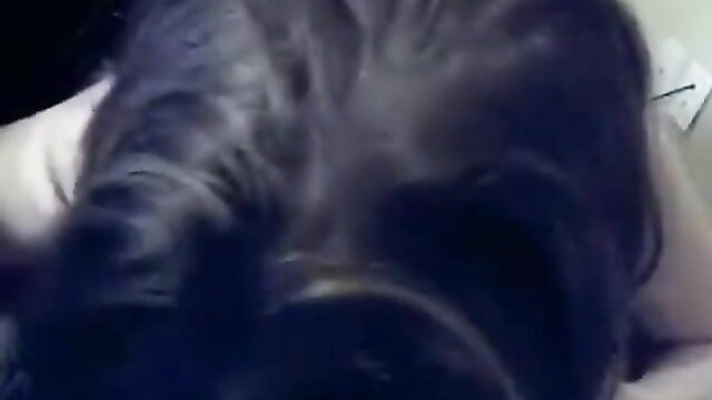 Homemade couple closeup of woman's dark hair and neck during intimate sex