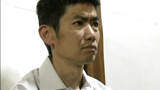 Japanese MILF in white shirt with intense gaze, JAV mother taboo thumbnail