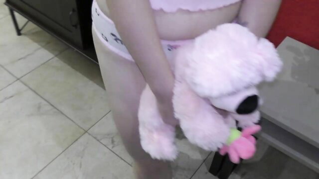 Cute Asian amateur teen in panties hugging pink teddy bear