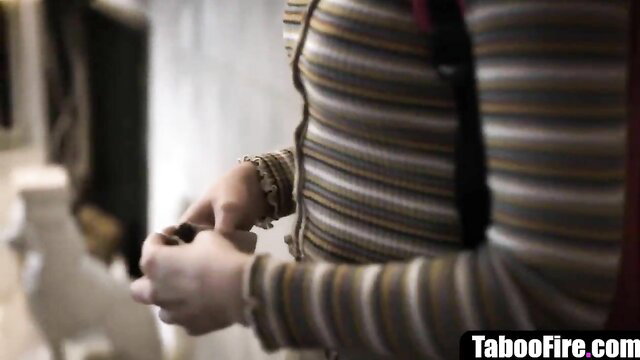 Aften Opal in striped top, hands near crotch in taboo deflowering scene