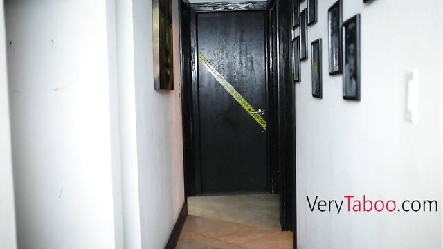 Kourtney Kai in dark hallway with black door, taboo stepsis tease