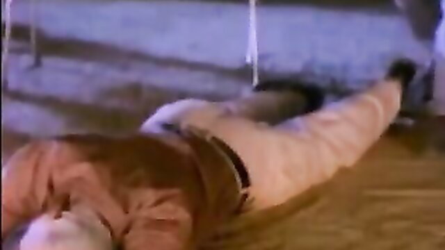 Yamini lying on floor in tight pants, legs spread wide, teasing pose