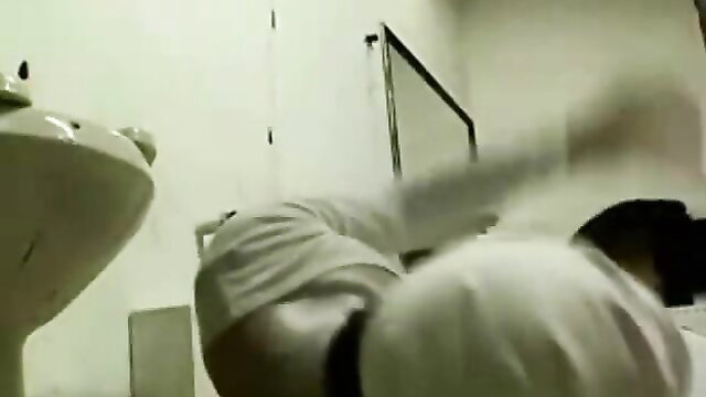 Amateur Asian man bent over sink in white shirt, surprise gay bathroom scene