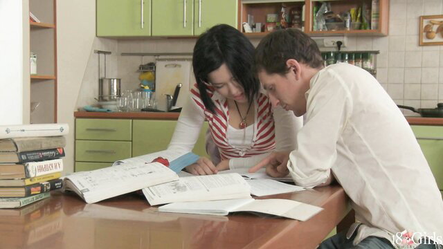 Netta Jade and friend studying books at kitchen table