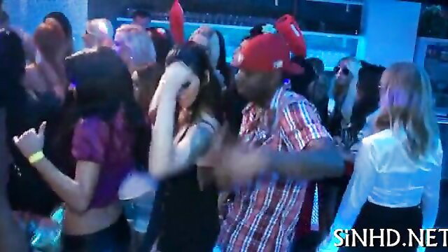 Crowd of hot party girls dancing with black guy in club, wet raunchy fun