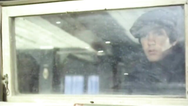 Anita Blonde peeking thru window in Americans Abroad 1977