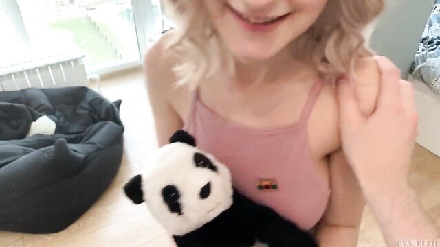 Eva Elfie blonde babe in pink top holding panda plush toy