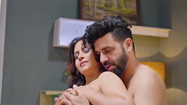 Indian couple nude embrace, curvy brunette woman hugs bearded man intimately