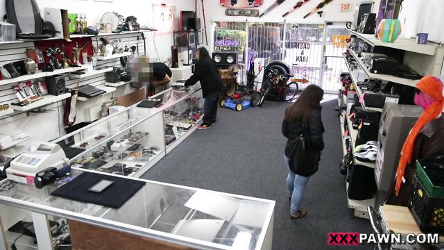 Hot chicks browsing pawn shop shelves in tight jeans