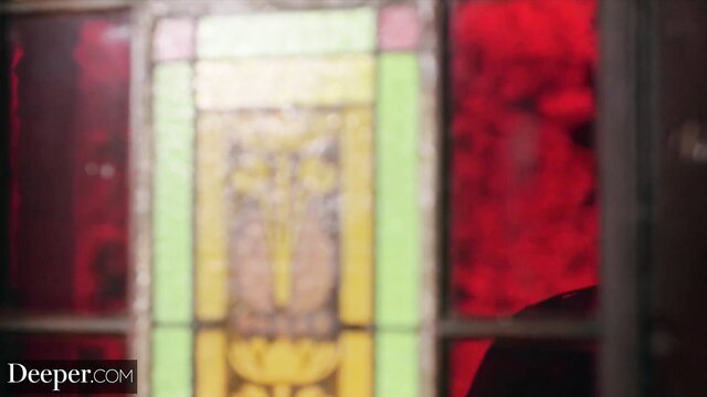 Amber Moore teases through stained glass in sexy uniform